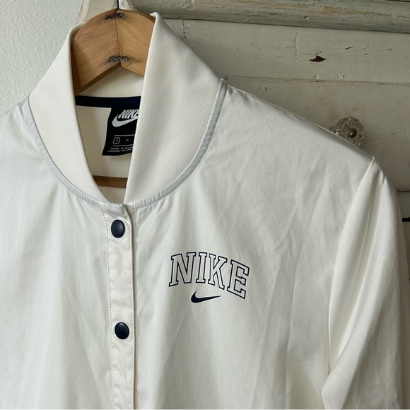 Nike | Women's Cream Snap-Front Varsity Style Jacket side pockets black logos S - Picture 11 of 16